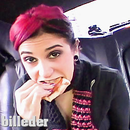 Joanna Angel eating a sandwich in a limo while sight seeing.